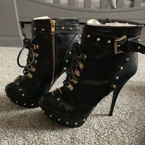 Black heeled spike boots.